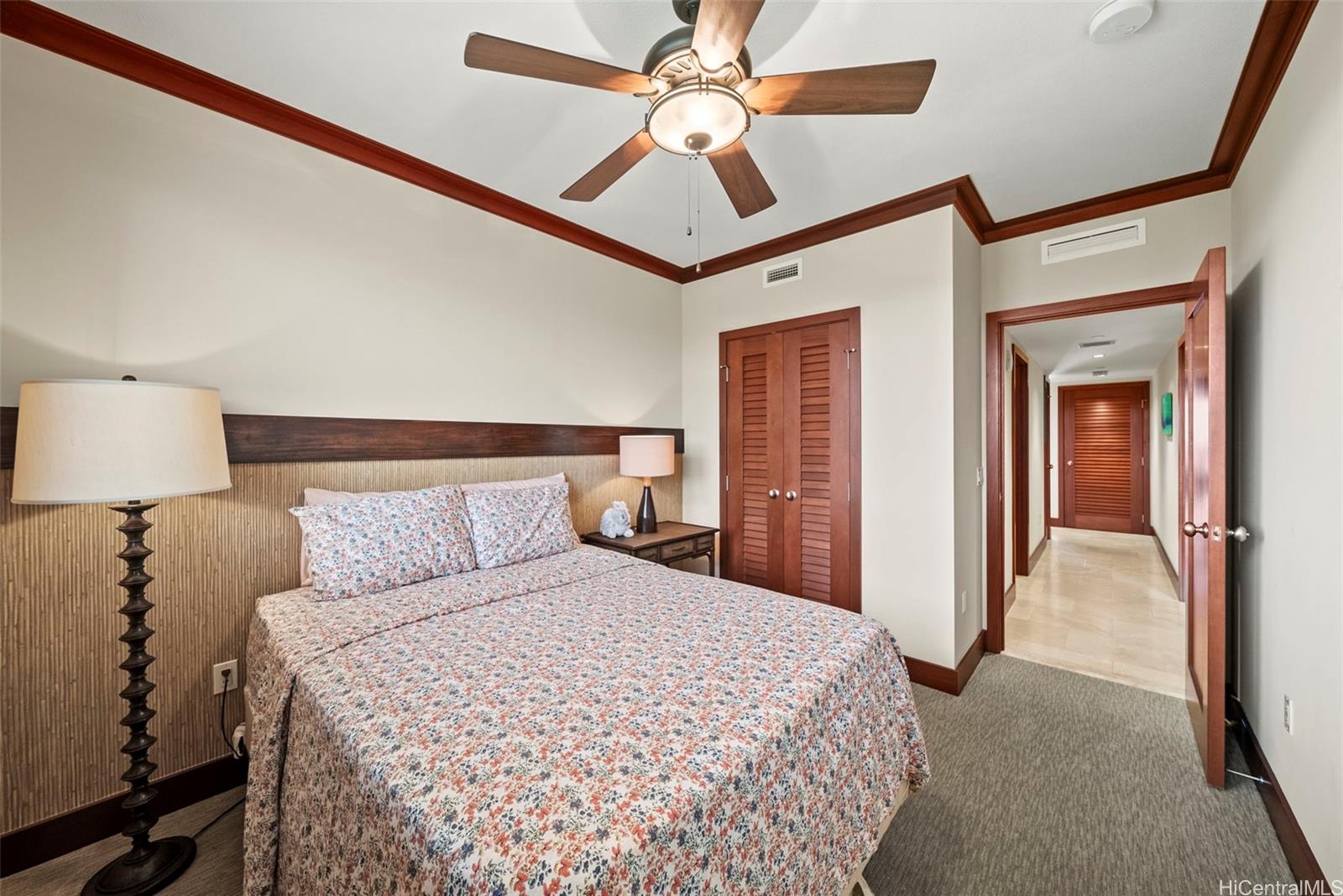 92-104 Waialii Place, Unit OPH 1401 Kapolei, HI 96707 - Photo 11 of 24 a bedroom with a bed and a ceiling fan
