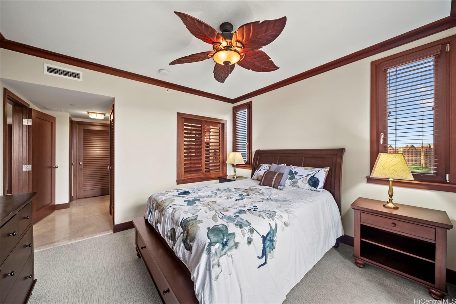 92-104 Waialii Place, Unit OPH 1401 Kapolei, HI 96707 - Photo 15 of 24 a bedroom with bed and a chandelier