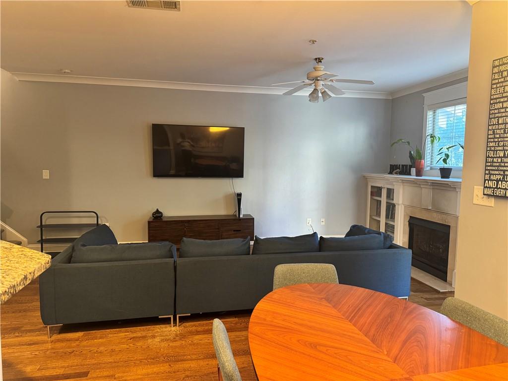 655 Mead Street Southeast, Unit 28 Atlanta, GA 30312 - Photo 11 of 42 a living room with furniture and a flat screen tv