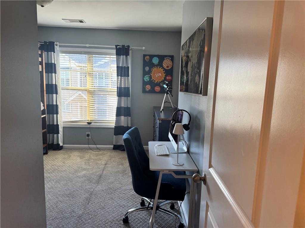 655 Mead Street Southeast, Unit 28 Atlanta, GA 30312 - Photo 26 of 42 a view of a workspace with furniture and a window