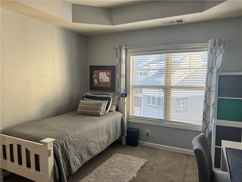 655 Mead Street Southeast, Unit 28 Atlanta, GA 30312 - Photo 30 of 42 a bedroom with a bed and a window