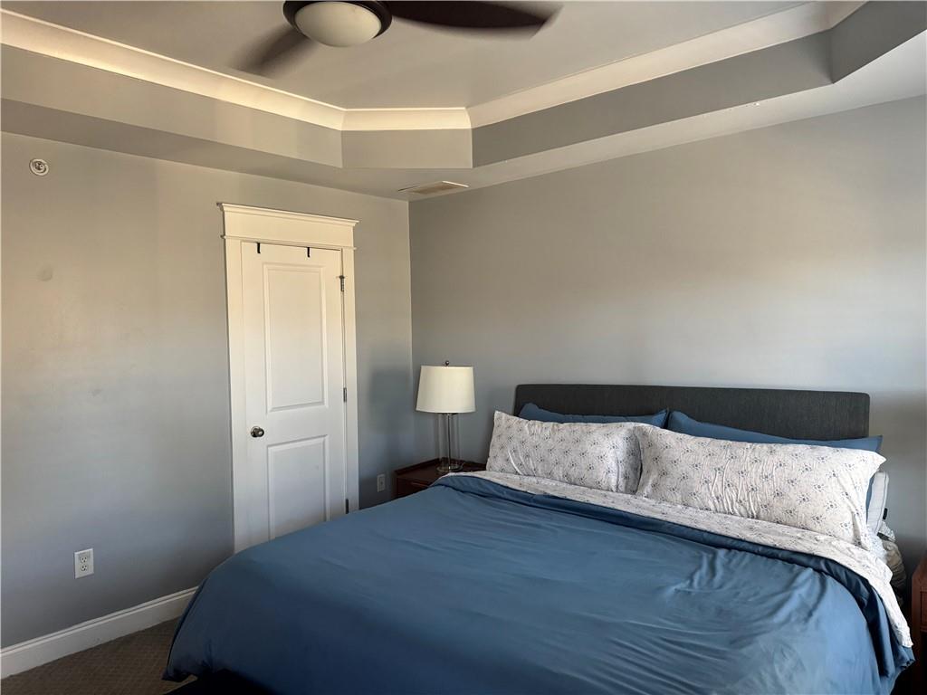 655 Mead Street Southeast, Unit 28 Atlanta, GA 30312 - Photo 38 of 42 a bedroom with a bed and lamp