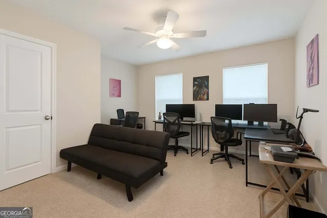 a living room with furniture and a window
