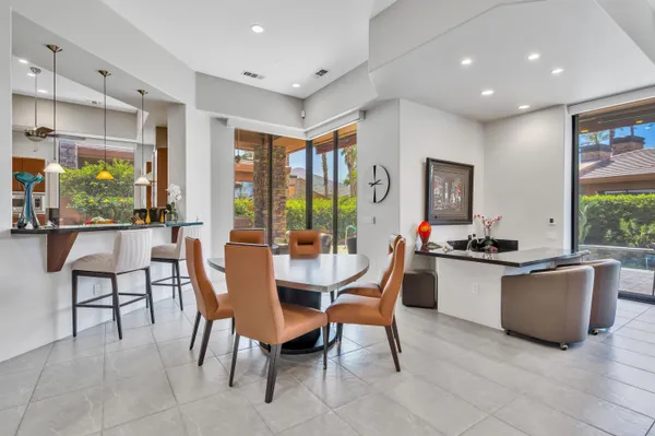 a view of a dining room with furniture window and outside view