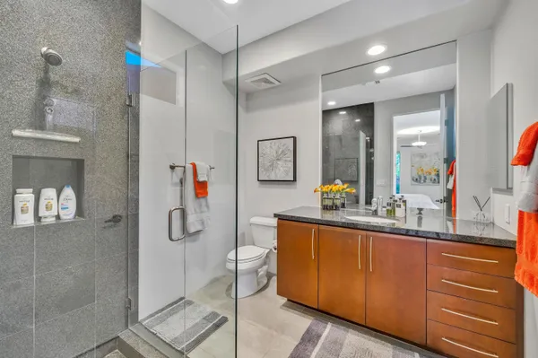 a very nice looking room with a large mirror and sink