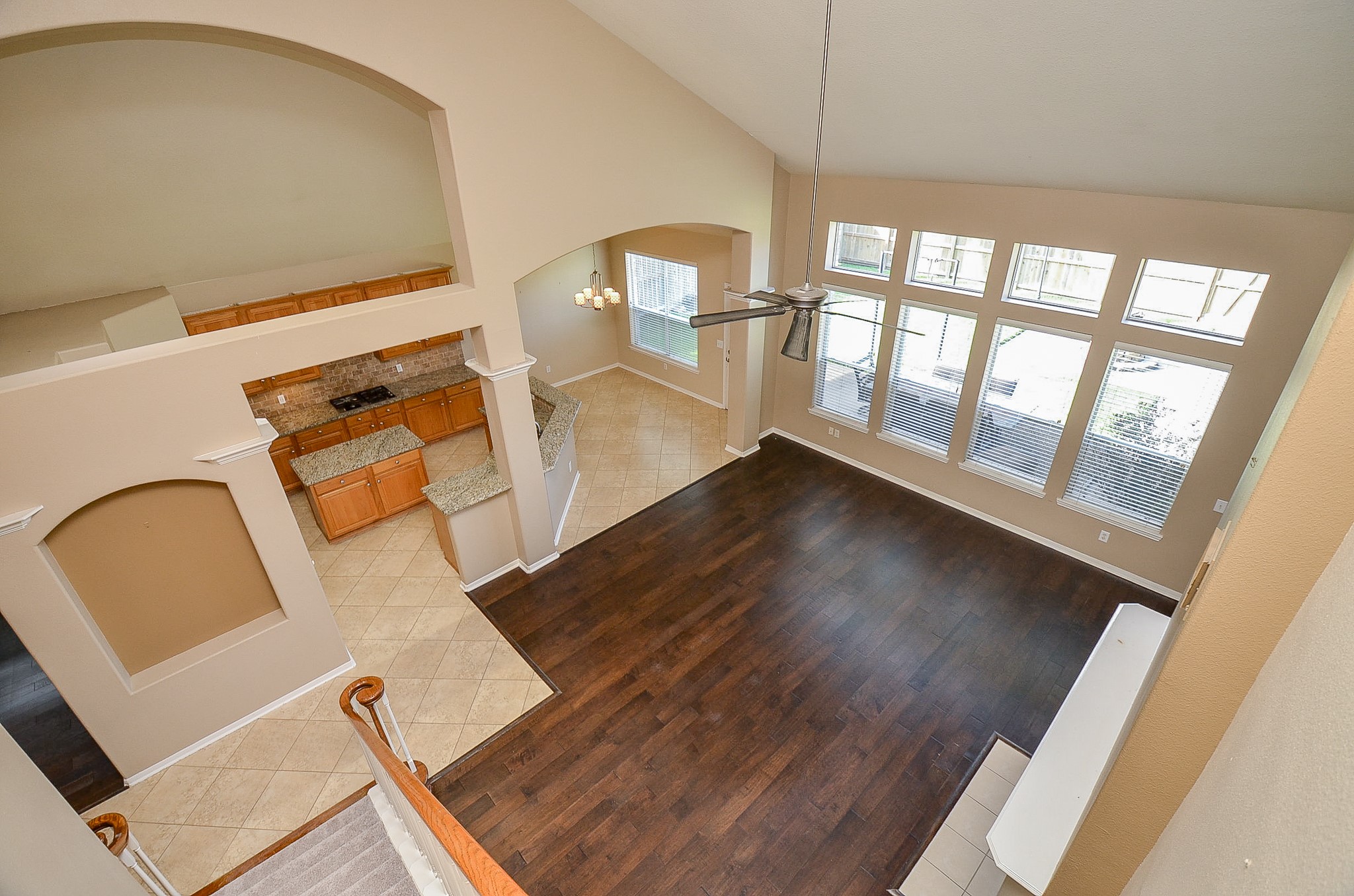 1222 Ragsdale Lane Katy, TX 77494 - Photo 10 of 31 A birds eye view of the kitchen/breakfast and family room. The cutouts in the walls add character to the spaces.