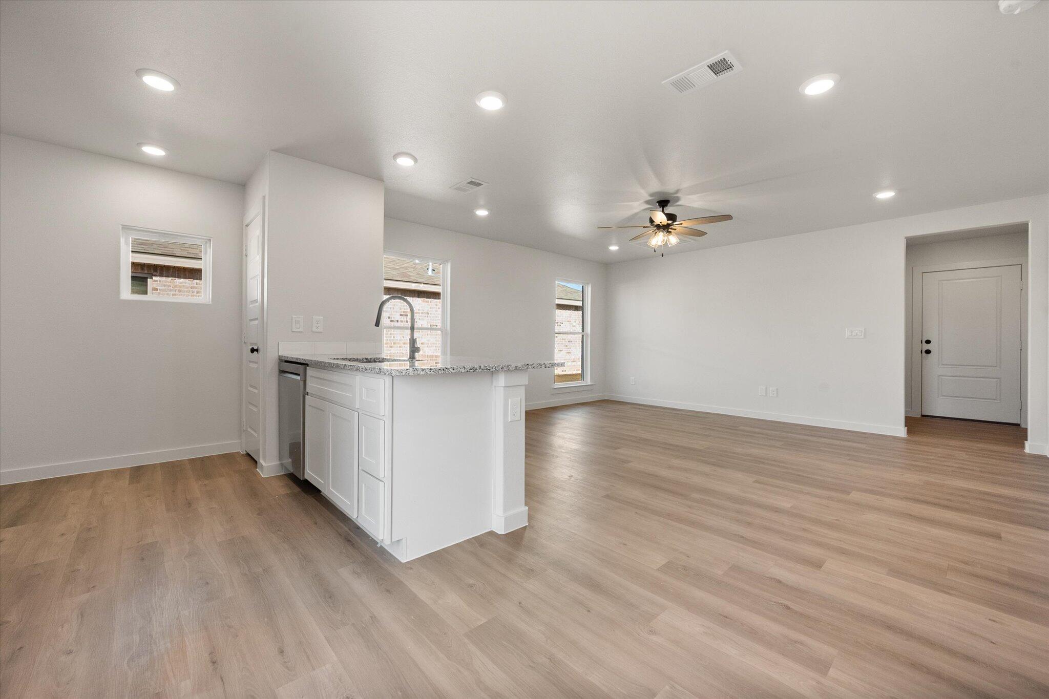 6308 Volney Avenue Lubbock, TX 79407 - Photo 11 of 19 a view of kitchen with kitchen island and stainless steel appliances
