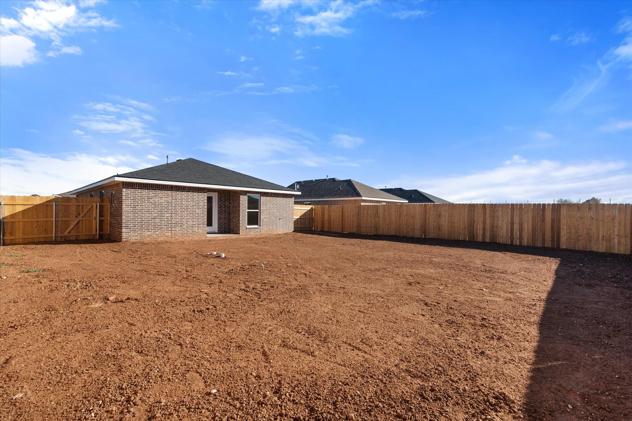 6308 Volney Avenue Lubbock, TX 79407 - Photo 18 of 19 a view of a house with wooden fence