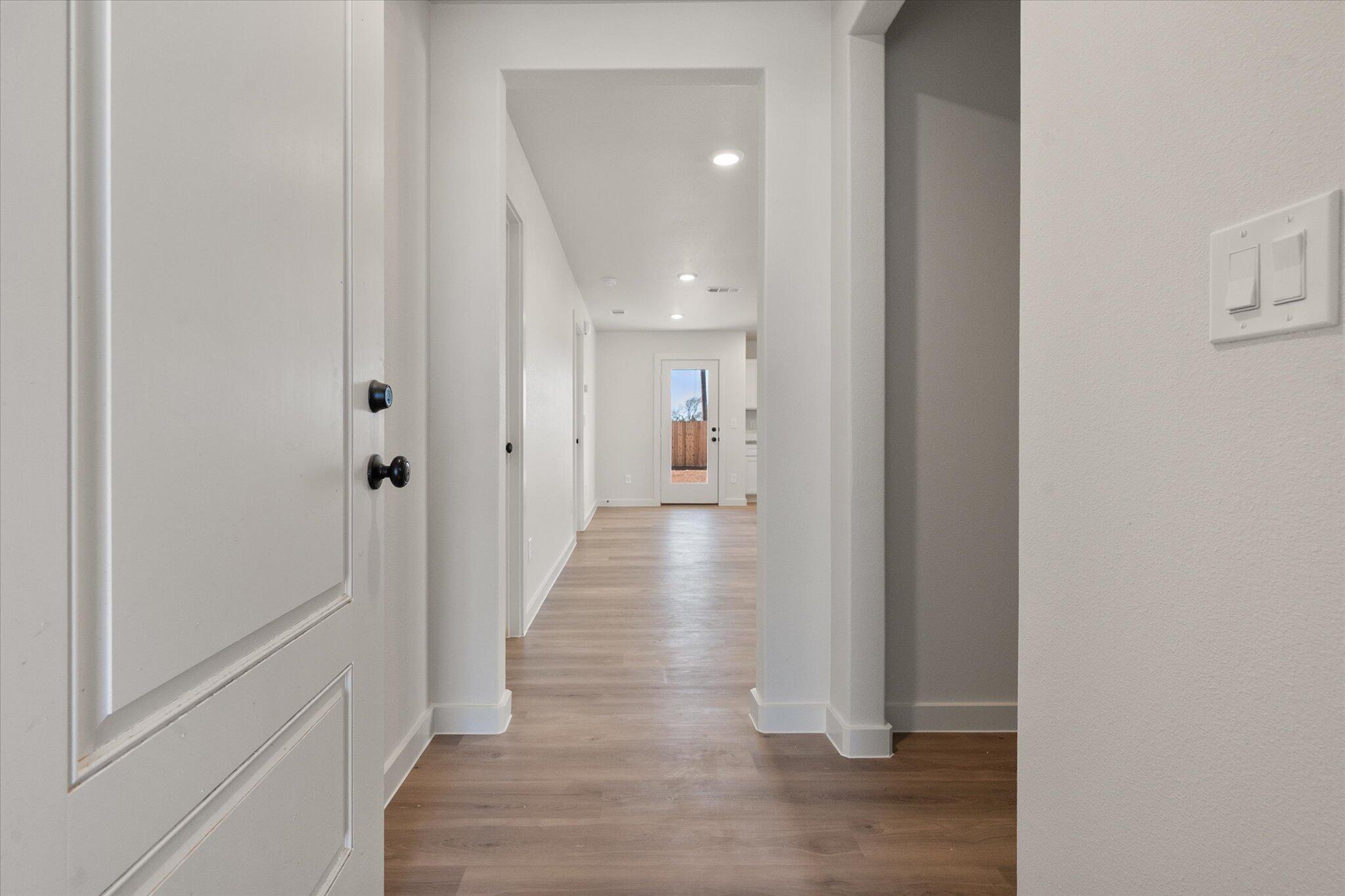 6308 Volney Avenue Lubbock, TX 79407 - Photo 2 of 19 a view of a hallway with wooden floor