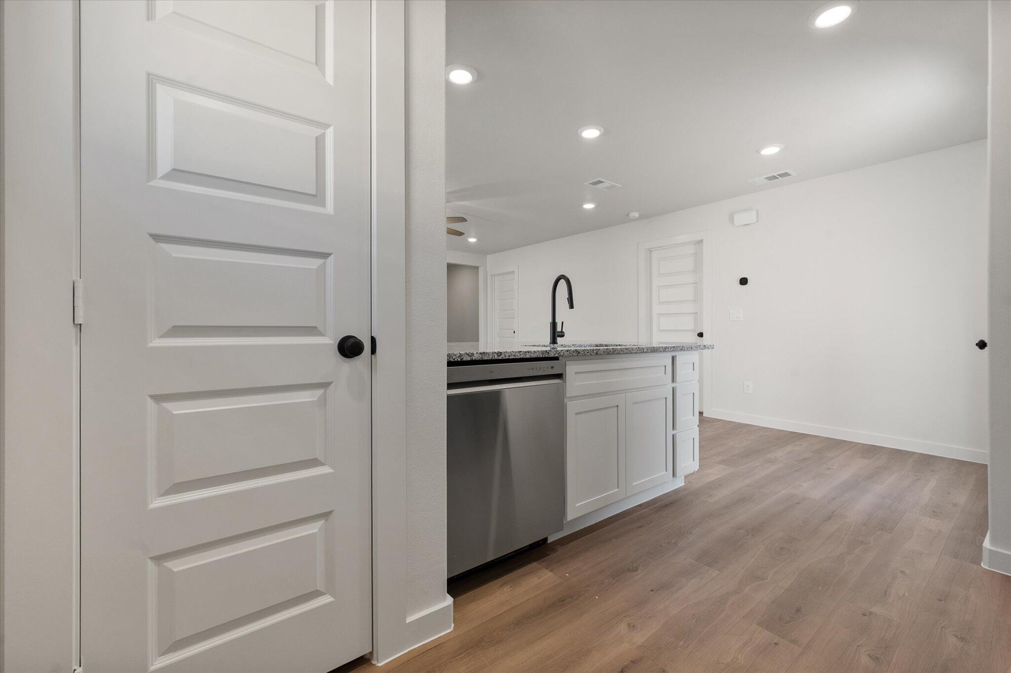 6308 Volney Avenue Lubbock, TX 79407 - Photo 10 of 19 a kitchen with a refrigerator sink and cabinets