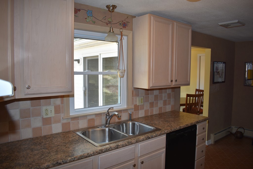 87 Logtown Road Amherst, MA 01002 - Photo 12 of 30 a kitchen with granite countertop a sink and a window