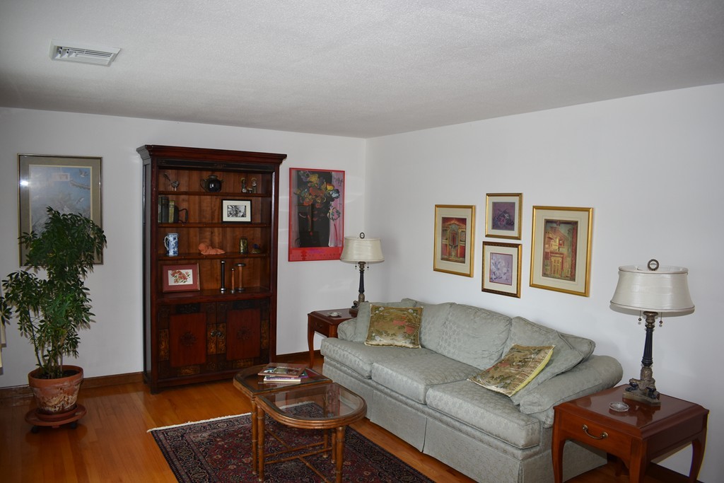 87 Logtown Road Amherst, MA 01002 - Photo 19 of 30 a living room with furniture and wooden floor