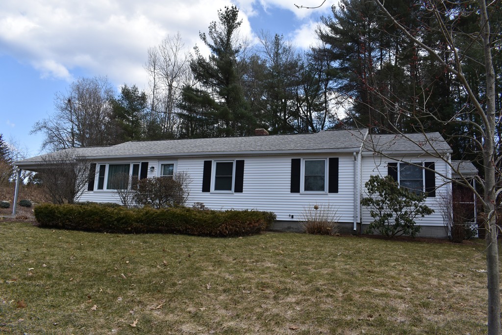 87 Logtown Road Amherst, MA 01002 - Photo 2 of 30 a front view of house with yard space and trees around