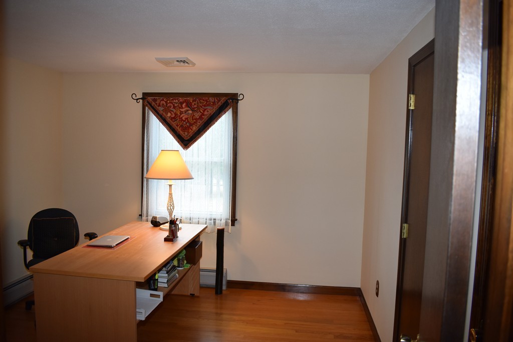 87 Logtown Road Amherst, MA 01002 - Photo 27 of 30 a room with a bed and wooden floor