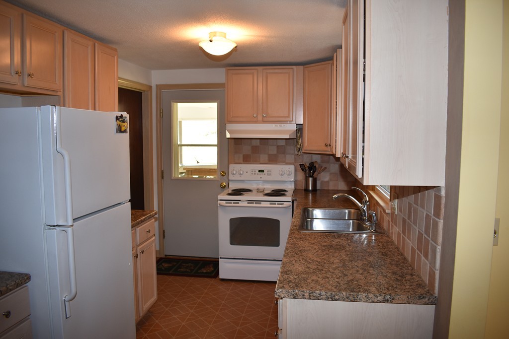 87 Logtown Road Amherst, MA 01002 - Photo 10 of 30 a kitchen with a refrigerator sink and stove