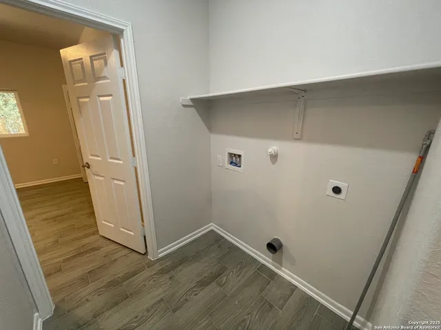 an empty room with wooden floor