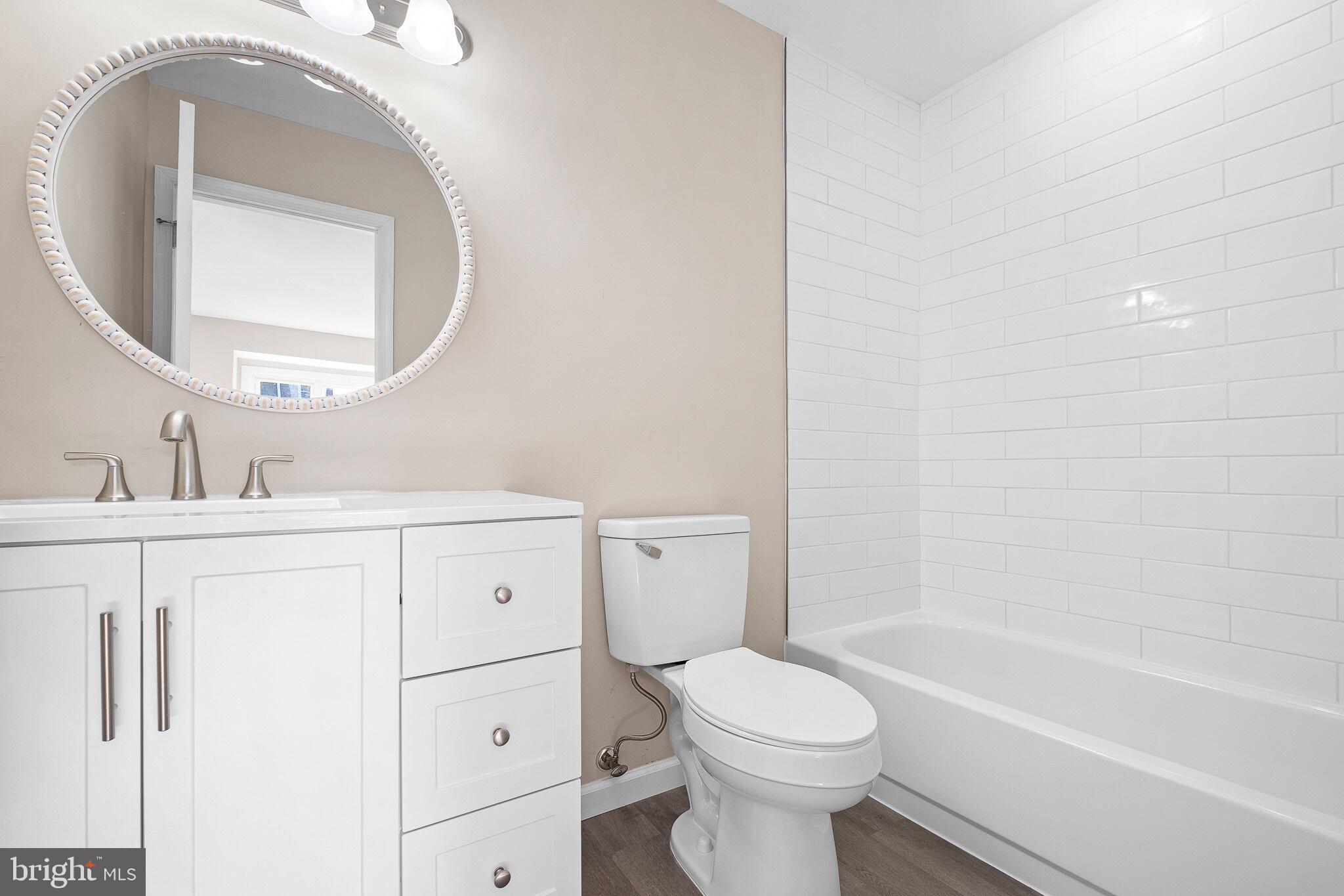 1301 Shallcross Avenue Wilmington, DE 19806 - Photo 19 of 33 a bathroom with a sink a toilet and bathtub