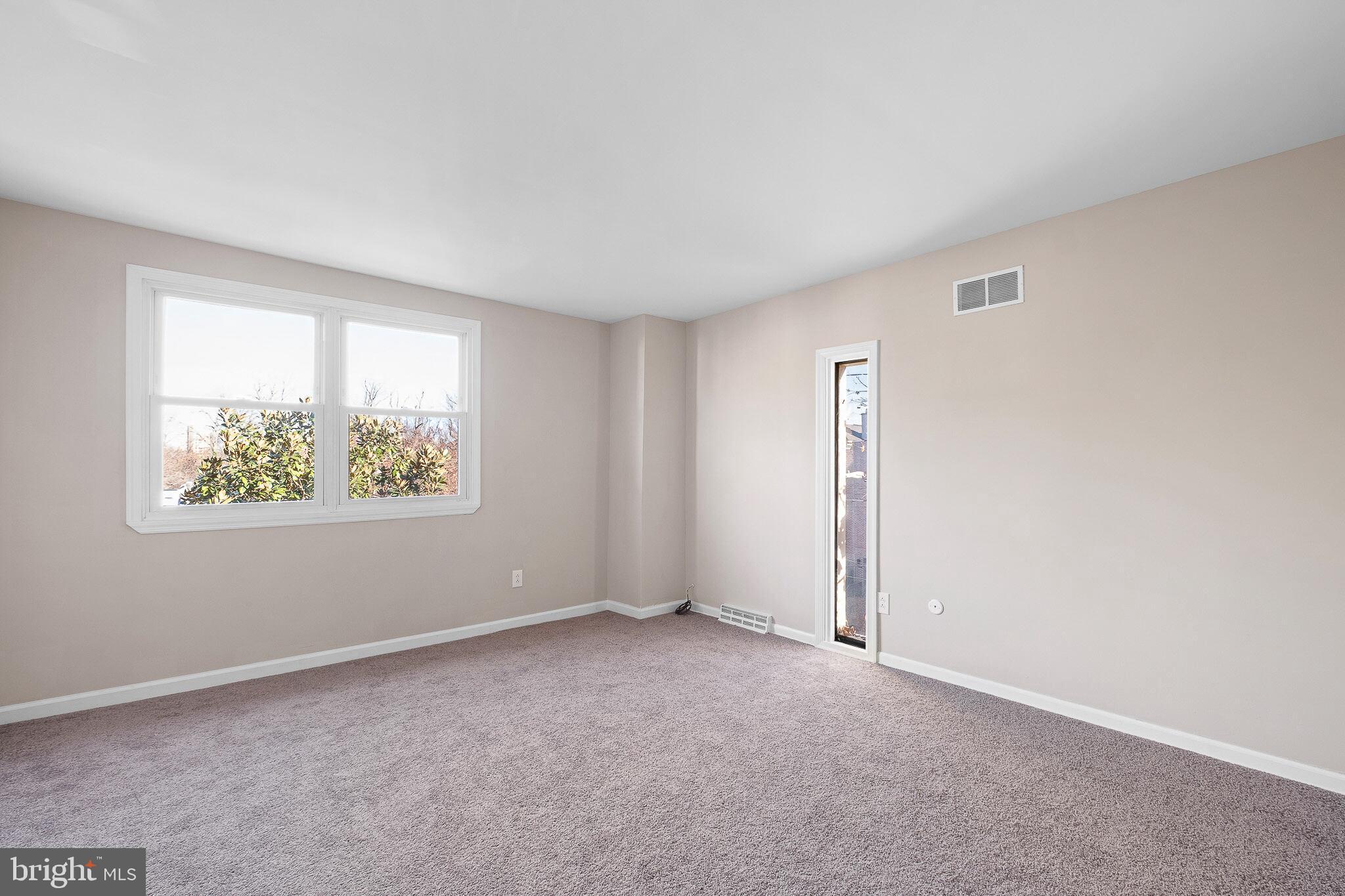 1301 Shallcross Avenue Wilmington, DE 19806 - Photo 20 of 33 an empty room with windows