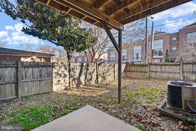 a view of a brick house with many windows