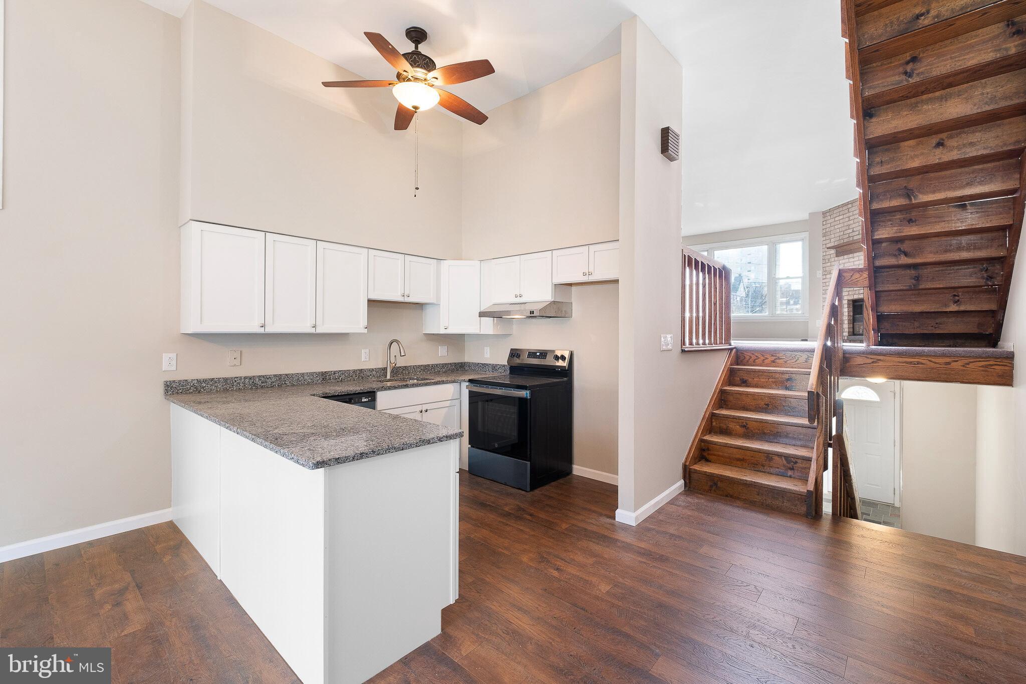 1301 Shallcross Avenue Wilmington, DE 19806 - Photo 9 of 33 a kitchen with stainless steel appliances a stove a sink and a refrigerator