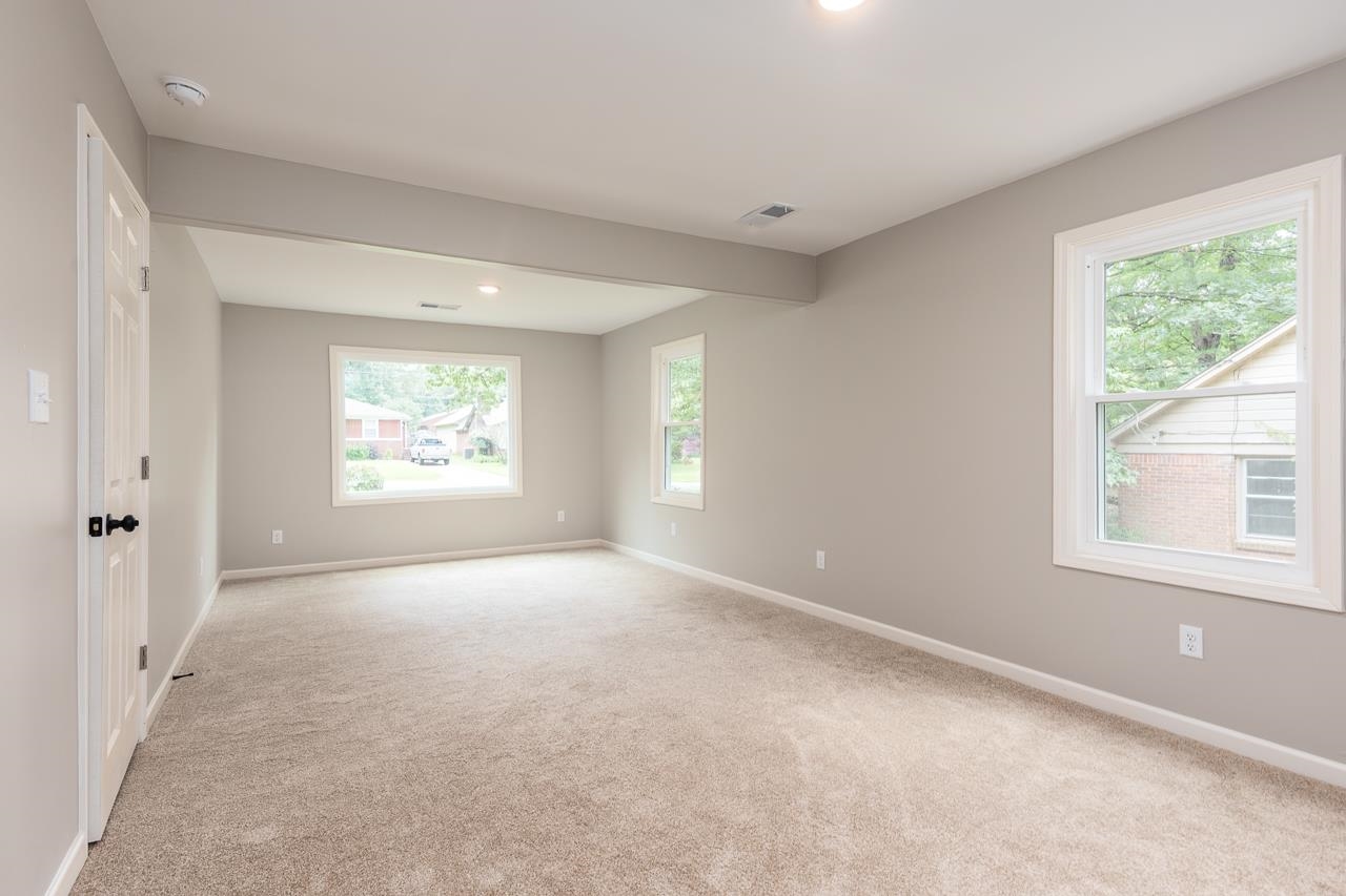 1461 Phillips Road Memphis, TN 38134 - Photo 9 of 19 an empty room with windows