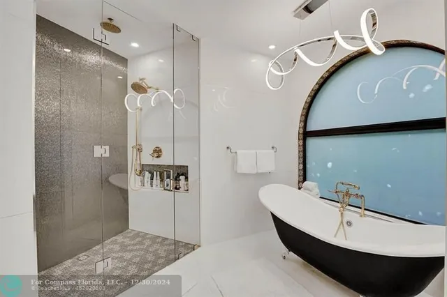 an aerial view of a house with garden space and street view