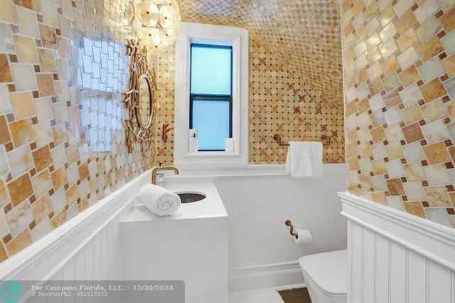 a view of a patio with table and chairs and potted plants