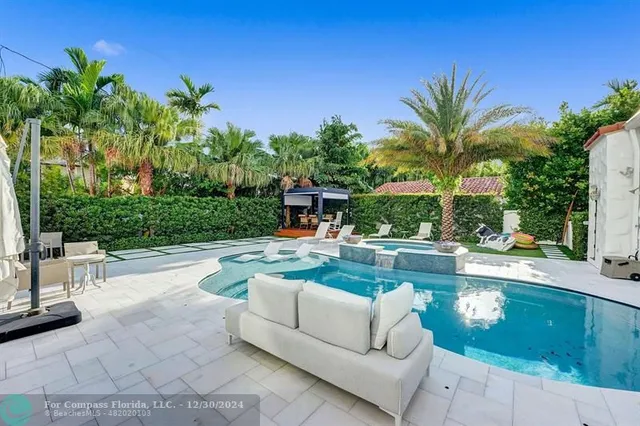 a kitchen with stainless steel appliances a stove a refrigerator and a sink