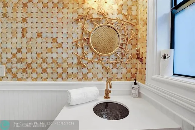 a bedroom with a large bed and a large window