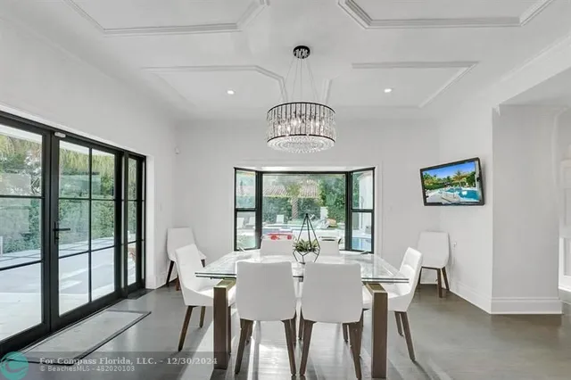 a bedroom with two beds and painting on the wall