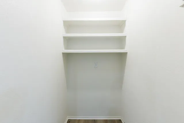 a view of an empty walk in closet