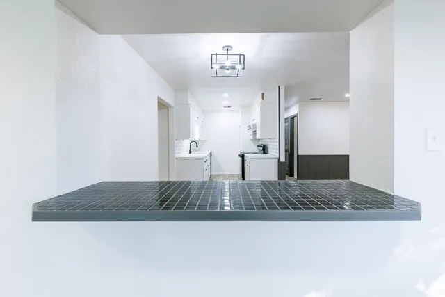 a view of kitchen and hallway