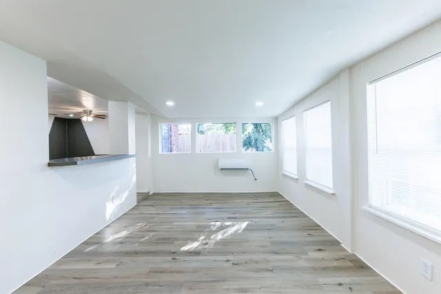 a view of an empty room and a window