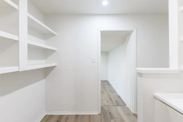 a view of staircase with white walls