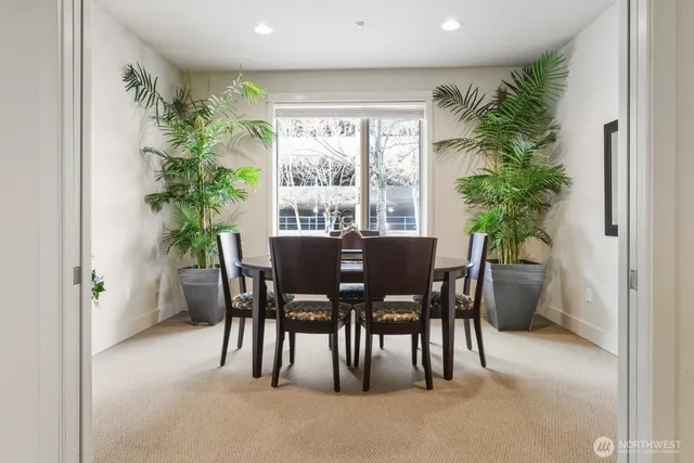 a view of a dining room with furniture window and outside view
