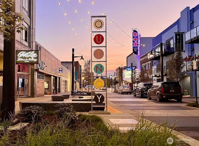 a view of swimming pool with outdoor seating and lake view