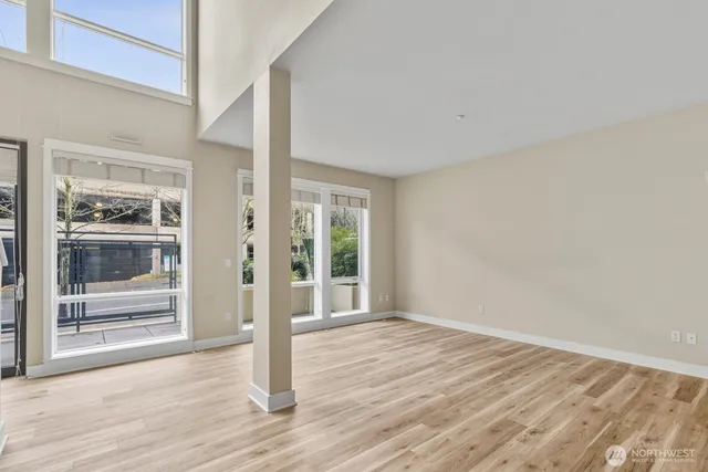 a view of wooden floor and brick walls