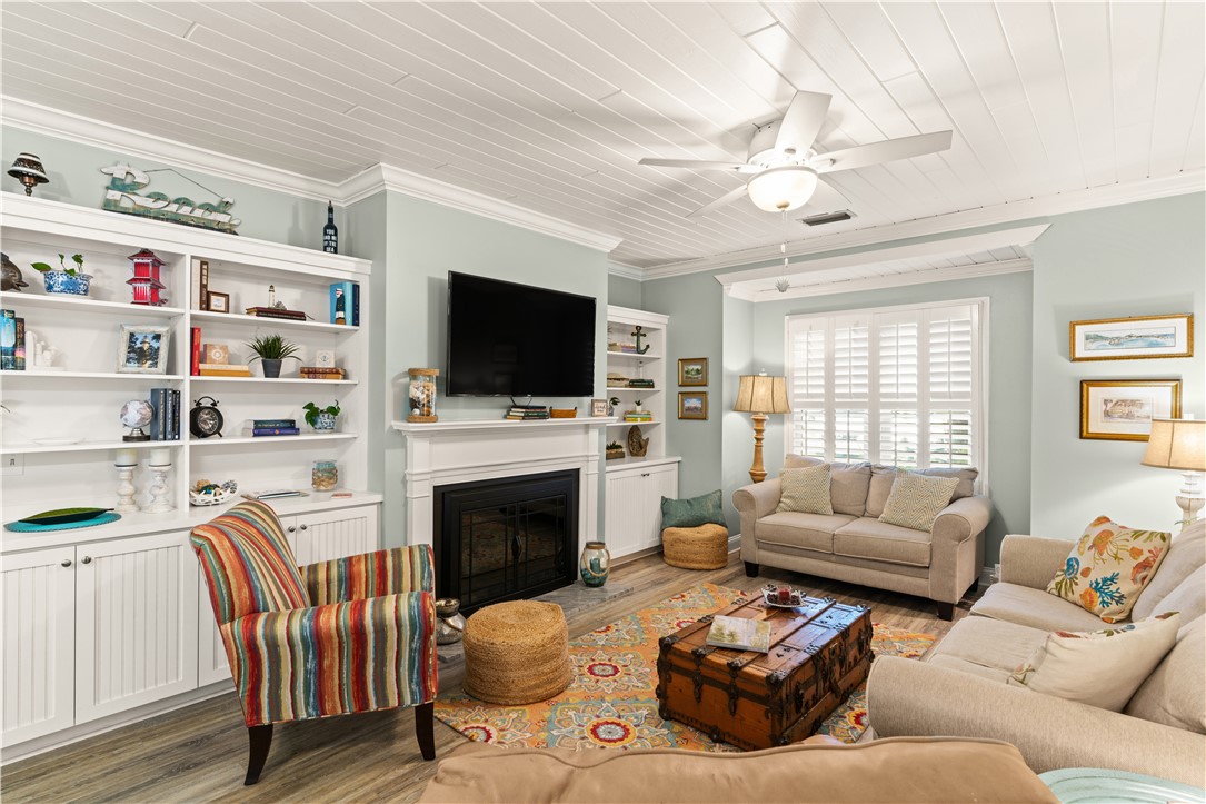 1035 Beach View Drive, Unit 201 St. Simons Island, GA 31522 - Photo 8 of 18 Beautiful bookshelve and fireplace