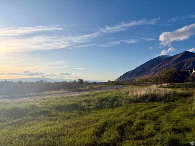 2057 East Maple Hills Lane, Unit 109 Mapleton, UT 84664 - Photo 2 of 4 Expansive grassy terrain with mountain backdrop