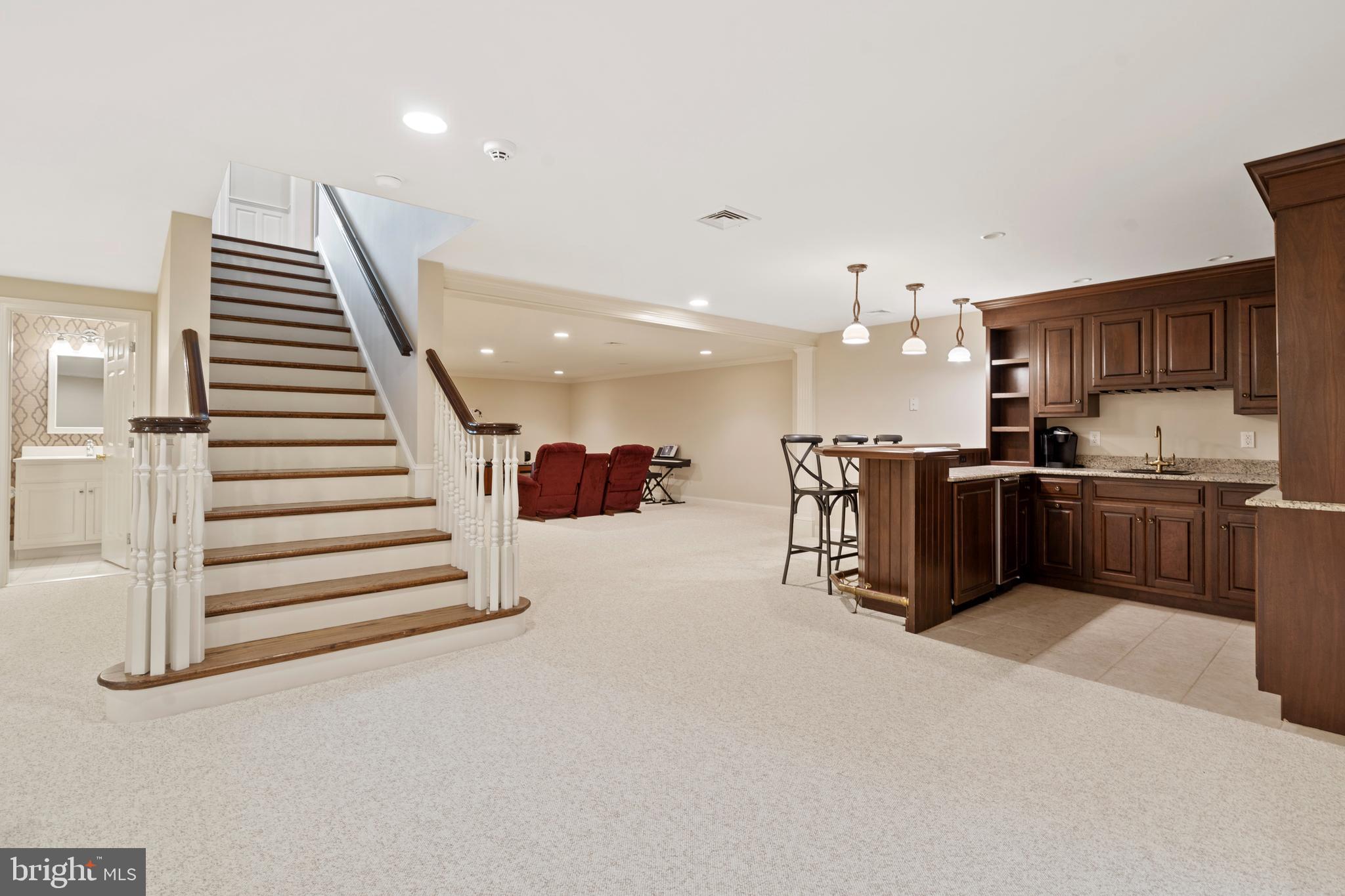 211 Atlee Road Wayne, PA 19087 - Photo 53 of 90 Lower Level with bar seating and kitchenette