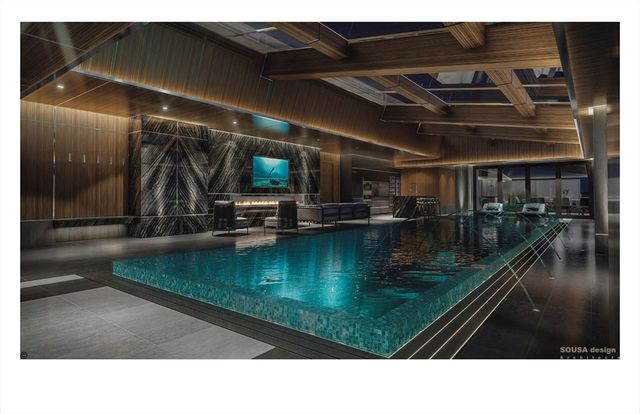 a bathroom with a sink a mirror and tub