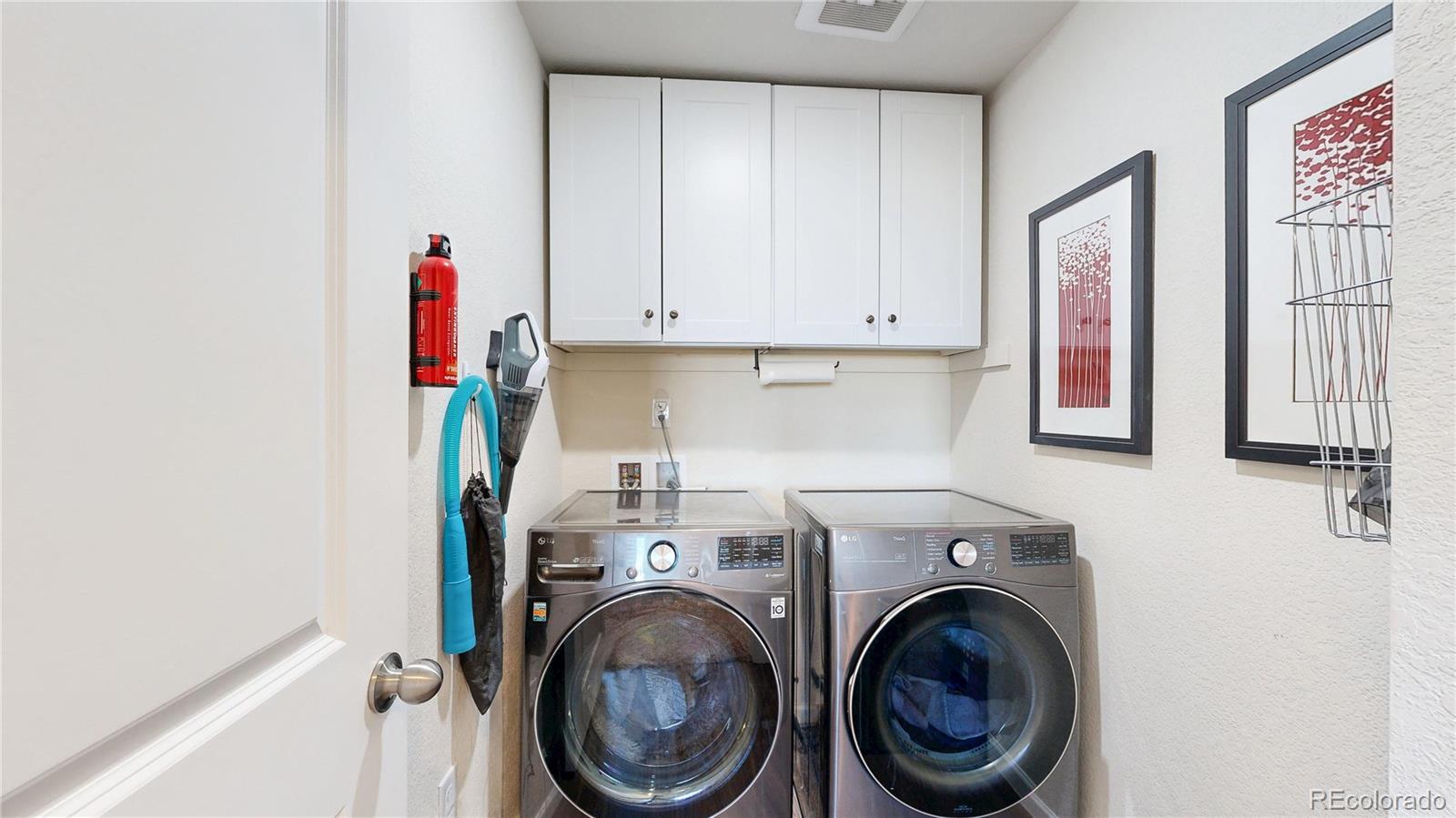 26709 East 1st Place Aurora, CO 80018 - Photo 19 of 50 a utility room with dryer and washer