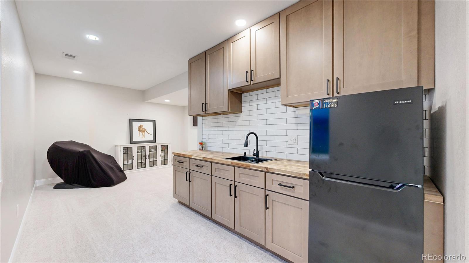 26709 East 1st Place Aurora, CO 80018 - Photo 29 of 50 a kitchen with stainless steel appliances cabinets and a counter top space