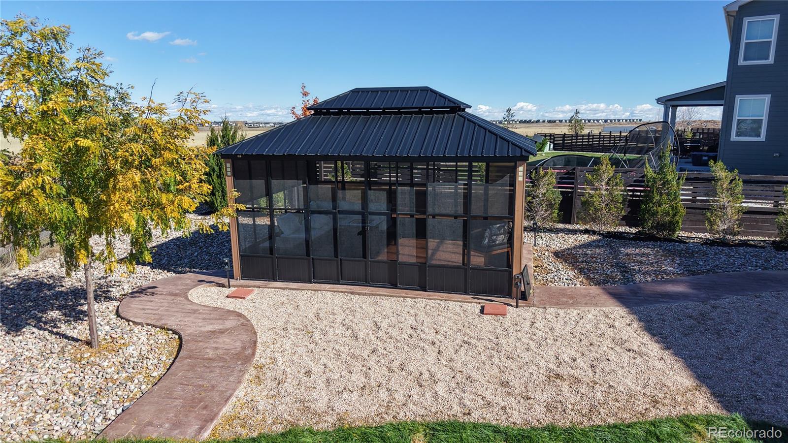 26709 East 1st Place Aurora, CO 80018 - Photo 34 of 50 a view of a house with a yard