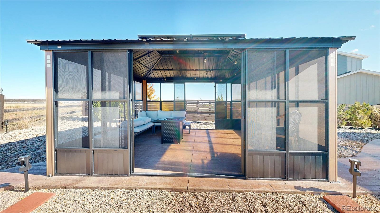 26709 East 1st Place Aurora, CO 80018 - Photo 35 of 50 a view of a living room and a wooden floor