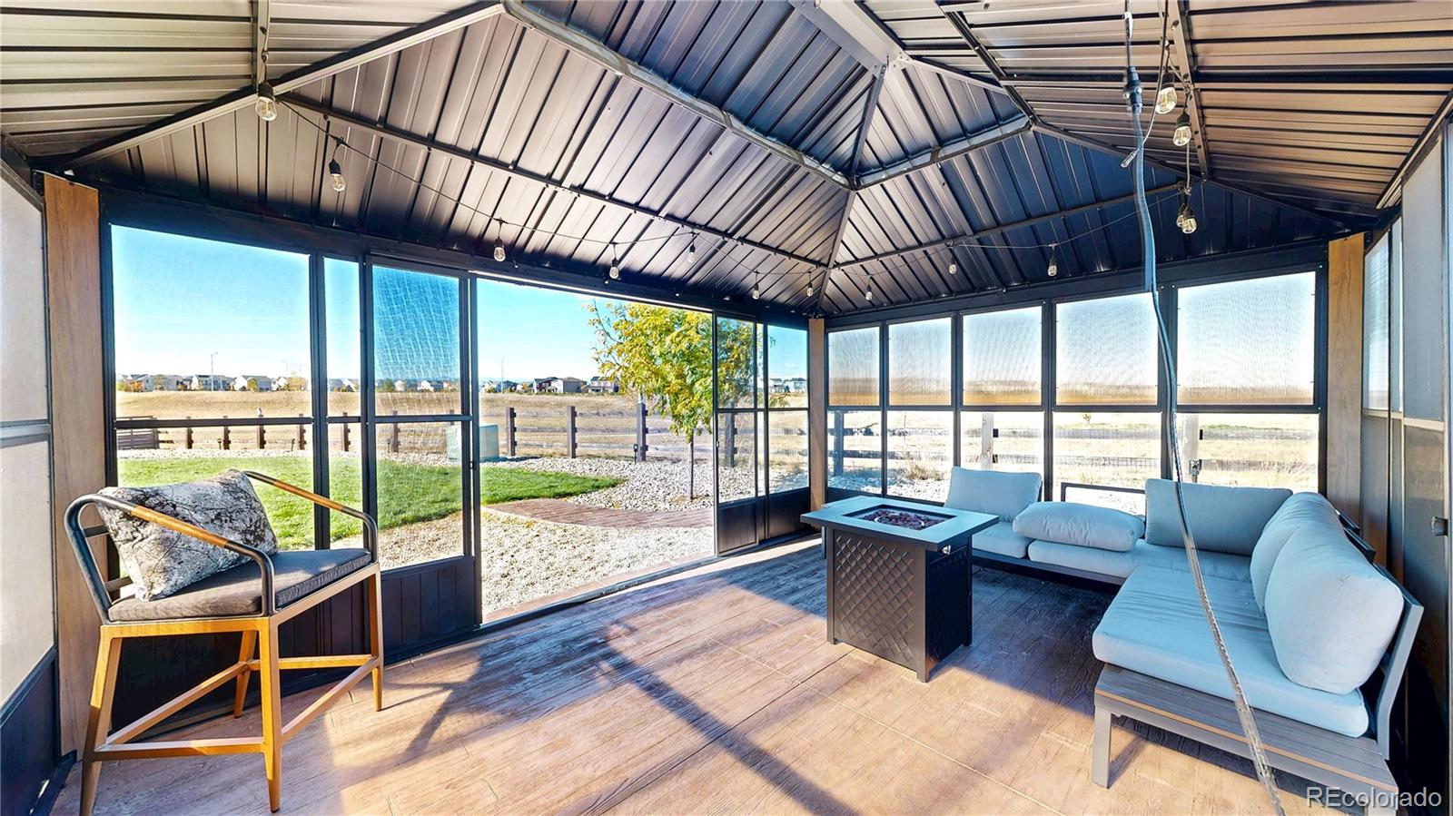 26709 East 1st Place Aurora, CO 80018 - Photo 36 of 50 a view of a dining room with furniture window and outside view