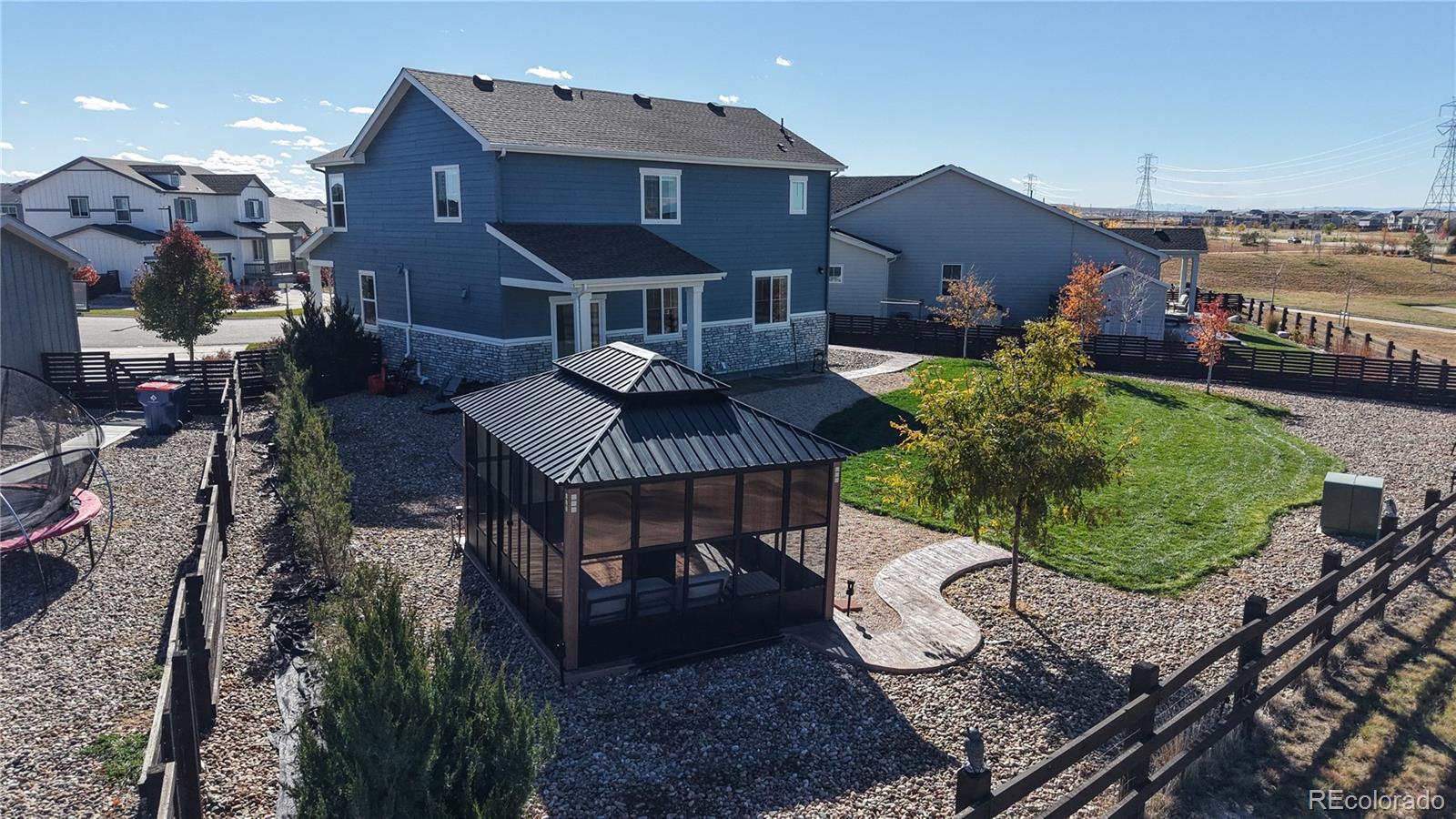 26709 East 1st Place Aurora, CO 80018 - Photo 40 of 50 a view of a house with backyard and sitting area