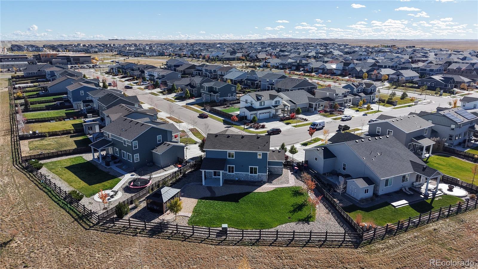 26709 East 1st Place Aurora, CO 80018 - Photo 44 of 50 an aerial view of a house with a yard garage and a ocean