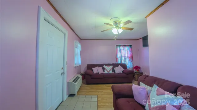 a living room with furniture and a rug