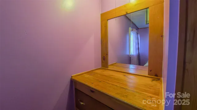 a kitchen that has a sink cabinets and a window